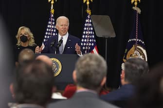 BUFFALO, NEW YORK - MAY 17: With his wife Jill by his side, US President Joe Biden delivers remarks to guests, most of whom lost a family member in the Tops market shooting, at the Delavan Grider Community Center on May 17, 2022 in Buffalo, New York. The president and first lady placed flowers at a memorial outside of the Tops market and met with families of victims prior to addressing the guests at the community center. A gunman opened fire at the Tops market on Saturday killing ten people and wounding another three. The attack was believed to be motivated by racial hatred.  (Photo by Scott Olson/Getty Images)