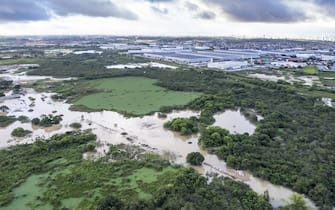 JABOATAO DOS GUARARAPES, BRAZIL - MAY 30: An aerial view of flooded area in Jaboatao dos Guararapes, in Recife, Pernambuco State, Brazil, on May 30, 2022. The death toll from the landslides and floods caused by heavy rains rose to 100 on Tuesday in the metropolitan region of Recife. The floods and landslides triggered by heavy rains killed 100 people and displaced hundreds of others. The number of people missing, which was previously reported at 56, still could not be determined clearly as search and rescue efforts are underway to reach out to the marooned people. (Photo by Diogo Duarte/Anadolu Agency via Getty Images)