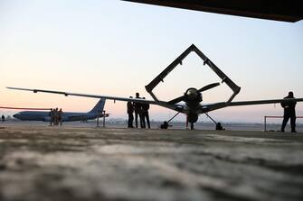 epa09227772 A view of the Turkish Bayraktar TB2 combat drones at the Incirlik air base, Turkey, 25 May 2021. The official visit of the Polish presidential couple to Turkey is underway.  Poland has signed an agreement to purchase four sets with 24 unmanned aerial air apparatuses capable of carrying anti-tank missiles.  EPA / LESZEK SZYMANSKI POLAND OUT