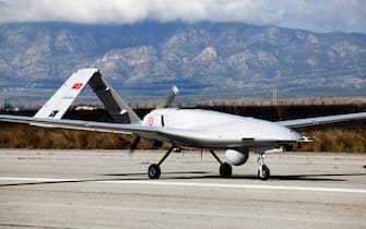 The Turkish-made Bayraktar TB2 drone is pictured on December 16, 2019 at Gecitkale military airbase near Famagusta in the self-proclaimed Turkish Republic of Northern Cyprus (TRNC).  - The Turkish military drone was delivered to northern Cyprus amid growing tensions over Turkey's deal with Libya that extended its claims to the gas-rich eastern Mediterranean.  The Bayraktar TB2 drone landed in Gecitkale Airport in Famagusta around 0700 GMT, an AFP correspondent said, after the breakaway northern Cyprus government approved the use of the airport for unmanned aerial vehicles.  It followed a deal signed last month between Libya and Turkey that could prove crucial in the scramble for recently discovered gas reserves in the eastern Mediterranean.  (Photo by Birol BEBEK / AFP) (Photo by BIROL BEBEK / AFP via Getty Images)