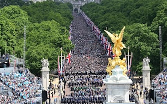 Members of the public fill The Mall ahead of a fly-past over Buckingham Palace, during the Queen's Birthday Parade, the Trooping the Colour, as part of Queen Elizabeth II's Platinum Jubilee celebrations, in London on June 2, 2022. - Huge crowds converged on central London in bright sunshine on Thursday for the start of four days of public events to mark Queen Elizabeth II's historic Platinum Jubilee, in what could be the last major public event of her long reign. (Photo by Paul ELLIS / POOL / AFP) (Photo by PAUL ELLIS/POOL/AFP via Getty Images)