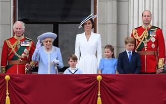 Britain's Queen Elizabeth II (2L) stands with from left, Britain's Prince Charles, Prince of Wales, Britain's Prince Louis of Cambridge, Britain's Catherine, Duchess of Cambridge, Britain's Princess Charlotte of Cambridge , Britain's Prince George of Cambridge, Britain's Prince William, Duke of Cambridge, , to watch a special flypast from Buckingham Palace balcony following the Queen's Birthday Parade, the Trooping the Colour, as part of Queen Elizabeth II's platinum jubilee celebrations, in London on June 2, 2022. - Huge crowds converged on central London in bright sunshine on Thursday for the start of four days of public events to mark Queen Elizabeth II's historic Platinum Jubilee, in what could be the last major public event of her long reign. (Photo by Daniel LEAL / AFP) (Photo by DANIEL LEAL/AFP via Getty Images)