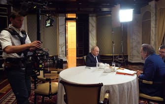 In this picture taken on June 19, 2019 US film director Oliver Stone interviews Russian President Vladimir Putin in Moscow.  (Photo by Alexey DRUZHININ / SPUTNIK / AFP) (Photo credit should read ALEXEY DRUZHININ / AFP via Getty Images)