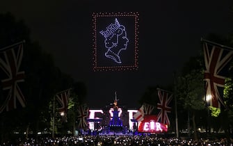 LONDON, ENGLAND - JUNE 04: Drones form symbols of celebration over the crowds during the Platinum Party At The Palace concert outside Buckingham Palace on June 4, 2022 in London, United Kingdom. The Platinum Jubilee of Elizabeth II is being celebrated from June 2 to June 5, 2022, in the UK and Commonwealth to mark the 70th anniversary of the accession of Queen Elizabeth II on 6 February 1952. (Photo by Hollie Adams/Getty Images)