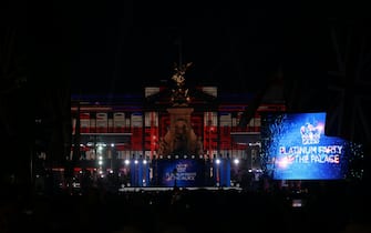 LONDON, ENGLAND - JUNE 04: A light show is projected onto Buckingham Palace during the Platinum Party At The Palace concert on June 4, 2022 in London, United Kingdom. The Platinum Jubilee of Elizabeth II is being celebrated from June 2 to June 5, 2022, in the UK and Commonwealth to mark the 70th anniversary of the accession of Queen Elizabeth II on 6 February 1952. (Photo by Hollie Adams/Getty Images)
