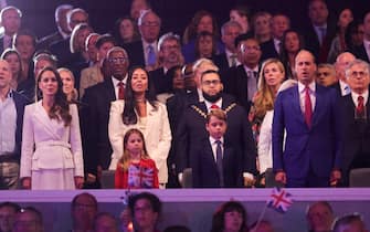 (From L) Britain's Catherine, Duchess of Cambridge, Britain's Princess Charlotte of Cambridge, Britain's Prince George of Cambridge abd Britain's Prince William, Duke of Cambridge, sing the British national anthem during the Platinum Party at Buckingham Palace on June 4, 2022 as part of Queen Elizabeth II's platinum jubilee celebrations. - Some 22,000 people and millions more at home are expected at a star-studded musical celebration for Queen Elizabeth II's historic Platinum Jubilee. (Photo by Chris Jackson / POOL / AFP) (Photo by CHRIS JACKSON/POOL/AFP via Getty Images)