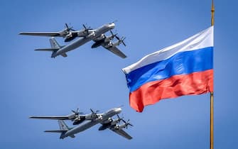 Russian Tupolev Tu-95 turboprop-powered strategic bombers fly above the Kremlin during a rehearsal for the Victory Day military parade in Moscow on May 4, 2018. - Russia celebrates the 73rd anniversary of the 1945 victory over Nazi Germany on May 9. (Photo by Yuri KADOBNOV / AFP)        (Photo credit should read YURI KADOBNOV/AFP via Getty Images)