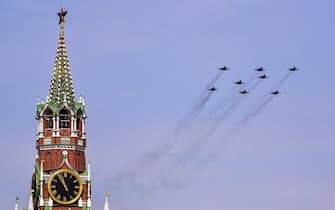 TOPSHOT - Russian MiG-29SMT jet fighters forming the symbol "Z" in support of Russian military action in Ukraine, fly over Red Square during the general rehearsal of the Victory Day military parade in central Moscow on May 7, 2022. - Russia will celebrate the 77th anniversary of the 1945 victory over Nazi Germany on May 9. (Photo by Yuri KADOBNOV / AFP) (Photo by YURI KADOBNOV/AFP via Getty Images)