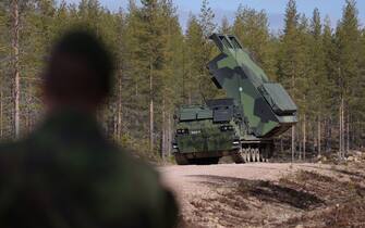 ROVANIEMI, FINLAND - MAY 23: An M270 MLRS heavy rocket launcher of the Finnish military participates in the LIST 22 live-fire Lightning Strike military exercises at the Rovajärvi training grounds on May 23, 2022 near Rovaniemi, Finland. Finland, after decades of neutrality, is applying along with Sweden for membership in the NATO military alliance as a consequence of Russia's military invasion and ongoing war in Ukraine. Russia, which shares a 1,340km long border with Finland, has reacted angrily to the move and has shut down all natural gas exports to Finland in response. (Photo by Sean Gallup/Getty Images)