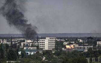 A photograph shows an explosion in the city of Severodonetsk during heavy fightings between Ukrainian and Russian troops at eastern Ukrainian region of Donbas on May 30, 2022, on the 96th day of the Russian invasion of Ukraine. - EU leaders will try to overcome Hungary's rejection of a Russian oil embargo on May 30, 2022 as part of a further tightening of sanctions against Moscow, whose forces are advancing in eastern Ukraine, with fighting in the heart of the key city of Severodonetsk. (Photo by ARIS MESSINIS / AFP) (Photo by ARIS MESSINIS/AFP via Getty Images)