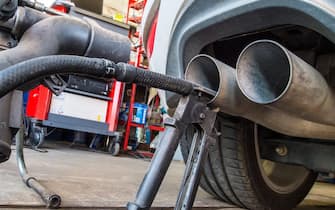 A probe of a device used for Diesel engine emission tests has been attached to an exhaust pipe of a VW Golf 2.0 TDI car in a repair shop in Frankfurt/Oder, Germany, 21 September 2015. ANSA/Patrick Pleul