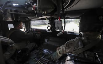 epa09992800 Ukrainian servicemen patrol territory in an APC near the front line in the city of Severodonetsk, Luhansk region, Ukraine, 02 June 2022, where heavy fighting took place in the last few days. While addressing the Luxembourg parliament, Ukrainian President Volodymyr Zelensky said that as of 02 June, about 20 percent of Ukraine is under the control of Russia. Russian troops on 24 February entered Ukrainian territory, starting a conflict that has provoked destruction and a humanitarian crisis.  EPA/STR