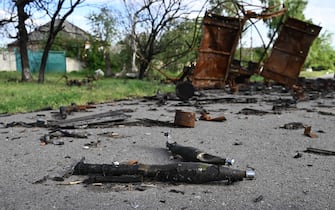 This photograph taken on May 28, 2022 shows abandoned ammunitions next to a destroyed military vehicle near the village of Rus'ka Lozova, north of Kharkiv, amid Russian invasion of Ukraine. (Photo by Genya SAVILOV / AFP) (Photo by GENYA SAVILOV/AFP via Getty Images)