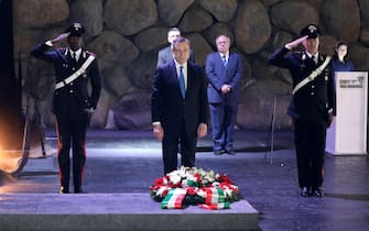 epa10012035 Italian Prime Minister Mario Draghi lays a wreath in the Hall of Remembrance at the Yad Vashem Holocaust memorial museum in Jerusalem, Israel, 14 June 2022. Draghi is on official visit.  EPA/ABIR SULTAN