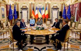 (From L) Italian Prime Minister Mario Draghi, German Chancellor Olaf Scholz, Ukrainian President Volodymyr Zelensky, French President Emmanuel Macron and Romanian President Klaus Iohannis meet for a working session in Mariinsky Palace, in Kyiv, on June 16, 2022. - It is the first time that the leaders of the three European Union countries have visited Kyiv since Russia's February 24 invasion of Ukraine. They are due to meet Ukrainian President Volodymyr Zelensky, at a time when Kyiv is pushing for membership of the EU. (Photo by Ludovic MARIN / POOL / AFP) (Photo by LUDOVIC MARIN/POOL/AFP via Getty Images)