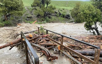 YELLOWSTONE NATIONAL PARK, WYOMING - JUNE 13:  In this handout photo provided by the National Park Service, tree logs pile up on a washed-out bridge as water levels rise near Rescue Creek on June 13, 2022 in Yellowstone National Park, Wyoming. (Photo by the National Park Service via Getty Images)