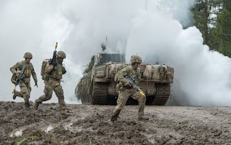 Picture taken on May 27, 2021 shows soldiers taking part in a large-scale exercise titled Spring Storm (Kevadtorm) led by Estonia, with the participation of NATO troops and the Estonian Defence Forces (EDF). - 7,000 soldiers from eight NATO countries are engaged in major military manoevers, about a hundred kilometers from the Russion border. (Photo by RAIGO PAJULA / AFP) (Photo by RAIGO PAJULA/AFP via Getty Images)