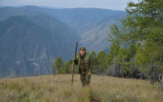 Russian President Vladimir Putin walks during his leisure time in the Siberian Taiga area on October 6, 2019. (Photo by Alexey DRUZHININ / Sputnik / AFP) (Photo by ALEXEY DRUZHININ / Sputnik / AFP via Getty Images)