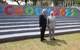 KIGALI, RWANDA - JUNE 23: Prince Charles, Prince of Wales (R) poses with Lord Jonathan Marland, Chair of the Commonwealth Enterprise and Investment Council (CWEIC) as he attends a Commonwealth Business Forum Exhibition at the Kigali Cultural Village on June 23, 2022 in Kigali, Rwanda. Prince Charles, The Prince of Wales has attended five of the 24 Commonwealth Heads of Government Meeting meetings held since 1971: Edinburgh in 1997, Uganda in 2007, Sri Lanka in 2013 (representing The Queen), Malta in 2015 and the UK in 2018. It was during the UK CHOGM that it was formally announced that The Prince would succeed The Queen as Head of the Commonwealth. Leaders of Commonwealth countries meet every two years for the meeting which is hosted by a different member country on a rotating basis. (Photo by Ian Vogler - Pool/Getty Images)