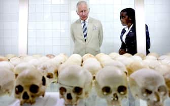 NYAMATA, RWANDA - JUNE 22: Prince Charles, Prince of Wales looks mournful as he is shown skulls of victims during a visit to the Nyamata Church Genocide Memorial where between the 14th and 16th April, 1994 approximately 5,000 Tutsis were killed inside Nyamata Church on June 22, 2022 in Nyamata, Rwanda. Prince Charles, The Prince of Wales has attended five of the 24 Commonwealth Heads of Government Meeting meetings held since 1971: Edinburgh in 1997, Uganda in 2007, Sri Lanka in 2013 (representing The Queen), Malta in 2015 and the UK in 2018. It was during the UK CHOGM that it was formally announced that The Prince would succeed The Queen as Head of the Commonwealth. Leaders of Commonwealth countries meet every two years for the meeting which is hosted by a different member country on a rotating basis. (Photo by Chris Jackson/Getty Images)