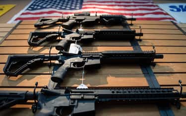 Assault rifles hang on the wall for sale at Blue Ridge Arsenal in Chantilly, Virginia, on October 6, 2017. / AFP PHOTO / JIM WATSON        (Photo credit should read JIM WATSON/AFP via Getty Images)