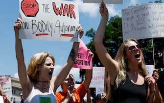 WASHINGTON, DC - JUNE 25: Abortion rights activists yell during a protest in the wake of the decision overturning Roe v. Wade  outside the U.S. Supreme Court Building on June 25, 2022 in Washington, DC. The Supreme Court's decision in Dobbs v Jackson Women's Health overturned the landmark 50-year-old Roe v Wade case and erased a federal right to an abortion. (Photo by Anna Moneymaker/Getty Images)