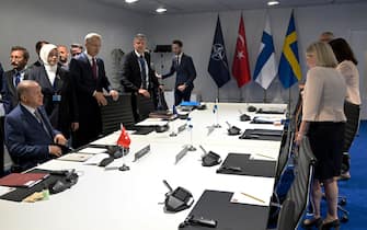 Turkey's President Recep Tayyip Erdogan (L), NATO Secretary General Jens Stoltenberg (C) and Sweden's Prime Minister Magdalena Andersson take part in a meeting on the sidelines of the NATO summit in Madrid, on June 28, 2022. - The leaders of Finland and Sweden met Turkish President Recep Tayyip Erdogan ahead of a NATO summit in Madrid to try to get him to drop objections to them joining, Swedish and Finnish officials said.  Erdogan has refused to greenlight the applications from the Nordic pair despite calls from his NATO allies to clear the path for them to enter.  - Sweden OUT (Photo by Henrik MONTGOMERY / TT News Agency / AFP) / Sweden OUT (Photo by HENRIK MONTGOMERY / TT News Agency / AFP via Getty Images)