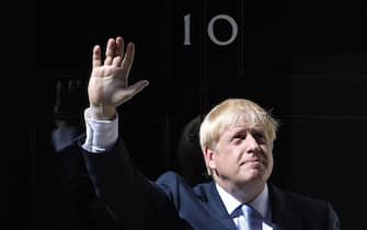 epa07737675 British Prime Minister Boris Johnson waves as he enters 10 Downing Street following his appointment by the Queen in London, Britain, 24 July 2019. Former London mayor and foreign secretary Boris Johnson is taking over the post after his election as party leader was announced the previous day. Theresa May stepped down as British Prime Minister following her resignation as Conservative Party leader on 07 June.  EPA/NEIL HALL