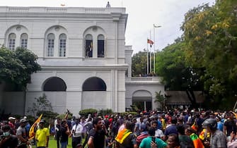 Protestors gather inside the compound of Sri Lanka's Presidential Palace in Colombo on July 9, 2022. - Sri Lanka's beleaguered President Gotabaya Rajapaksa fled his official residence in Colombo, a top defence source told AFP, before protesters gathered to demand his resignation stormed the compound. (Photo by AFP) (Photo by -/AFP via Getty Images)