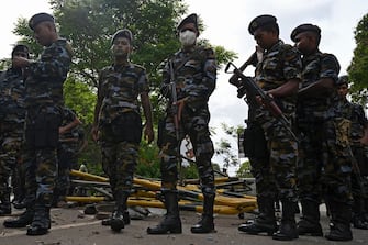 Cadets of Sri Lankan Air Force stand guard in front of the residence of Sri Lanka's Prime Minister, a day after it was vandalised by the protestors in Colombo on July 10, 2022. - Sri Lankan protesters set the prime minister's private home on fire, hours after chasing the president from his residence, as months of frustration over an unprecedented economic crisis boiled over on July 9. (Photo by Arun SANKAR / AFP) (Photo by ARUN SANKAR/AFP via Getty Images)