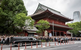 TOKYO, JAPAN - JULY 12: A car carrying the body of former Japanese Prime Minister Shinzo Abe leaves Zojoji temple following his funeral on July 12, 2022 in Tokyo, Japan. Abe was assassinated as he was campaigning at a rally in Nara on Friday. A suspect was apprehended and taken into custody, and confessed to shooting Abe with an improvised homemade gun. The killing of Japan's longest-serving prime minister in a country where gun violence is extremely rare has shocked the nation and the world. (Photo by Yuichi Yamazaki/Getty Images)