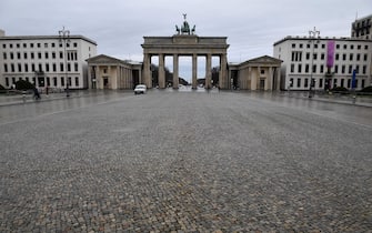 TOPSHOT - The near-empty Pariser Platz square in front of Berlin's landmark Brandenburg Gate (Brandenburger Tor) is pictured on January 22, 2021, during the ongoing novel coronavirus (Covid-19) pandemic. - Europe's top economy Germany this week extended its partial lockdown until February 14, 2021 and Chancellor Merkel has not ruled out border checks to slow the spread of the new strains. (Photo by Tobias Schwarz / AFP) (Photo by TOBIAS SCHWARZ/AFP via Getty Images)