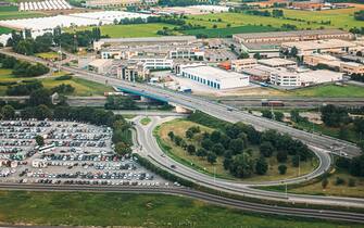 Bergamo, Italy - July 01, 2015: Aerial View Of Parking and Highway near Orio Al Serio International Airport.  Il Caravaggio International Airport, Is An International Airport Located In 3.7 Km Southeast Of Bergamo