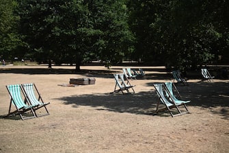 epa10077461 Empty deckchairs at St James's Park in London, Britain, 18 July 2022. The Met Office has issued a red extreme heat warning as the UK could have its hottest day on record this week, with temperatures forecast to hit up to 41 Celsius.  EPA/NEIL HALL