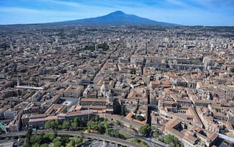 CATANIA, ITALY - MAY 01: Aerial view of Catania, in the background the volcano Etna, during an operational mission from the Coast Guard helicopter on May 01, 2020 in Catania, Italy.  Italy is still on lockdown to stem the transmission of the Coronavirus (Covid-19), but slowly easing restrictions.  (Photo by Fabrizio Villa / Getty Images)