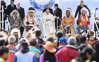 Pope Francis (C) arrives to speak to members of the Indigenous community at Muskwa Park in Maskwacis, Alberta, Canada, on July 25, 2022. - Pope Francis will make a historic personal apology Monday to Indigenous survivors of child abuse committed over decades at Catholic-run institutions in Canada, at the start of a week-long visit he has described as a "penitential journey." (Photo by Patrick T. FALLON / AFP) (Photo by PATRICK T. FALLON/AFP via Getty Images)
