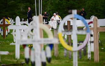 Pope Francis visits the Ermineskin Cree Nation Cemetery in Maskwacis, south of Edmonton, western Canada, on July 25, 2022. - Pope Francis visits Canada for a chance to personally apologise to Indigenous survivors of abuse committed over a span of decades at residential schools run by the Catholic Church. (Photo by Vincenzo PINTO / AFP) (Photo by VINCENZO PINTO/AFP via Getty Images)