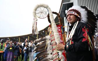Chief Tony Alexis, of the Alexis Nakota Sioux Nations, prepares to participate in the traditional entrance of Indigenous leaders (Grand Entry of Chiefs), ahead of the arrival of Pope Francis, at Muskwa Park in Maskwacis, Alberta, Canada, on July 25, 2022. - Pope Francis will make a historic personal apology Monday to Indigenous survivors of child abuse committed over decades at Catholic-run institutions in Canada, at the start of a week-long visit he has described as a "penitential journey." (Photo by Patrick T. FALLON / AFP) (Photo by PATRICK T. FALLON/AFP via Getty Images)