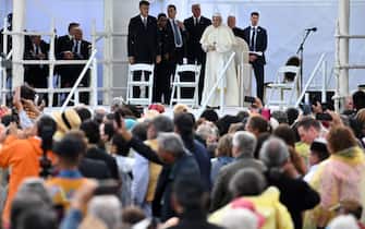 25 July 2022, Canada, Maskwacis: Pope Francis stands on a stage during his visit as part of his multi-day trip to Canada. Francis is visiting Canada to meet with the country's indigenous people, whose family members once suffered abuse, violence and humiliation in church-run boarding schools. Photo: Johannes Neudecker/dpa (Photo by Johannes Neudecker/picture alliance via Getty Images)