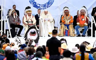 Pope Francis (C) speaks to members of the Indigenous community at Muskwa Park in Maskwacis, Alberta, Canada, on July 25, 2022. - Pope Francis will make a historic personal apology Monday to Indigenous survivors of child abuse committed over decades at Catholic-run institutions in Canada, at the start of a week-long visit he has described as a "penitential journey." (Photo by Patrick T. FALLON / AFP) (Photo by PATRICK T. FALLON/AFP via Getty Images)