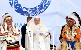 Pope Francis (C) speaks to members of the Indigenous community at Muskwa Park in Maskwacis, Alberta, Canada, on July 25, 2022. - Pope Francis will make a historic personal apology Monday to Indigenous survivors of child abuse committed over decades at Catholic-run institutions in Canada, at the start of a week-long visit he has described as a "penitential journey." (Photo by Patrick T. FALLON / AFP) (Photo by PATRICK T. FALLON/AFP via Getty Images)