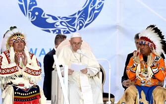 Pope Francis (C) speaks to members of the Indigenous community at Muskwa Park in Maskwacis, Alberta, Canada, on July 25, 2022. - Pope Francis will make a historic personal apology Monday to Indigenous survivors of child abuse committed over decades at Catholic-run institutions in Canada, at the start of a week-long visit he has described as a "penitential journey." (Photo by Patrick T. FALLON / AFP) (Photo by PATRICK T. FALLON/AFP via Getty Images)