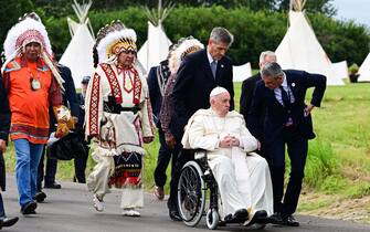 Pope Francis (2ndR) meets with indigenous peoples in Maskwacis, south of Edmonton, western Canada, on July 25, 2022. - Pope Francis visits Canada for a chance to personally apologize to Indigenous survivors of abuse committed over a span of decades at residential schools run by the Catholic Church. (Photo by Vincenzo PINTO / AFP) (Photo by VINCENZO PINTO/AFP via Getty Images)