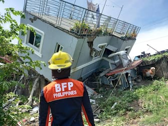 epa10093372 A handout photo made available by the Bureau of Fire Protection (BFP) shows a collapsed building following an earthquake in Santiago, Ilocos Sur province, Philippines, 27 July 2022. A strong quake with a 7.3 magnitude intensity that jolte?d Abra province in the main island of Luzon was registered by Philippine Institute of Volcanology and Seismology.  EPA/Bureau of Fire Protection (BFP) / HANDOUT  HANDOUT EDITORIAL USE ONLY/NO SALES
