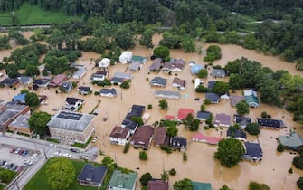 Aerial view of homes submerged under flood waters from the North Fork of the Kentucky River in Jackson, Kentucky, on July 28, 2022. - Flash flooding caused by torrential rains has killed at least eight people in eastern Kentucky and left some residents stranded on rooftops and in trees, the governor of the south-central US state said Thursday. (Photo by LEANDRO LOZADA / AFP) (Photo by LEANDRO LOZADA/AFP via Getty Images)