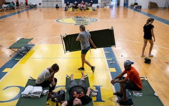 JACKSON, KY - JULY 28:  The Stivers family rest on cots, in the Hazard Community & Technical College, where survivors of the major flooding in Eastern Kentucky are being taken for shelter on July 28, 2022 in Breathitt County, Kentucky. The Stivers were airlifted from their roof after the father, Chad hammered a hole in the roof to climb out.  (Photo by Michael Swensen/Getty Images)