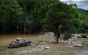 HAZARD, KY - JULY 29: A damaged vehicle and debris are seen along the Bert T Combs Mountain Highway on July 29, 2022 near Hazard, Kentucky. At least 16 people have been killed and hundreds had to be rescued amid flooding from heavy rainfall. (Photo by Michael Swensen/Getty Images)