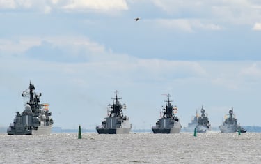 Russian warships sail in formation in the waters of the Gulf of Finland in Kronstadt during preparations for the Naval parade to be held in Saint Petersburg, on July 28, 2022. - The celebration of Navy Day in Russia is traditionally held on the last Sunday of July and will be celebrated on July 31 this year. (Photo by Olga MALTSEVA / AFP) (Photo by OLGA MALTSEVA/AFP via Getty Images)