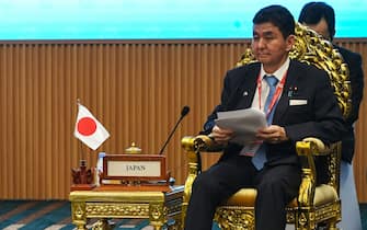 Cambodia's Deputy Prime Minister and Defence Minister Tea Banh (L) reads beside Japan's Defence Minister Nobuo Kishi during the Association of Southeast Asian Nations (ASEAN) Japan Defence Ministers Meeting (ADMM) in Phnom Penh on June 22, 2022. (Photo by TANG CHHIN Sothy / AFP) (Photo by TANG CHHIN SOTHY/AFP via Getty Images)