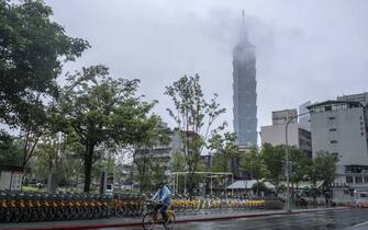 A cyclist passes the Taipei 101 building in Taipei, Taiwan, on Tuesday, May 24, 2022. US President Joe Biden is seeking to show US resolve against China, yet an ill-timed gaffe on Taiwan risks undermining his bid to curb Beijing’s growing influence over the region. Photographer: Lam Yik Fei/Bloomberg